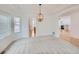 Elegant dining room features hardwood floors and a charming chandelier at 7447 Soapstone Way, Castle Rock, CO 80108