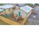 Backyard with gravel, wooden fence, and small deck at 3040 W 66Th Ave, Denver, CO 80221
