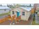 Quaint cottage-style home with a charming front porch at 3040 W 66Th Ave, Denver, CO 80221