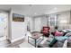 Living room with a view of the bathroom and entryway at 3040 W 66Th Ave, Denver, CO 80221
