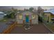 Front view of a charming house with a teal door at 3040 W 66Th Ave, Denver, CO 80221