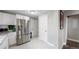 Kitchen with stainless steel refrigerator and pantry at 3040 W 66Th Ave, Denver, CO 80221