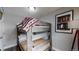 Cozy bedroom with a bunk bed, perfect for guests or children at 3040 W 66Th Ave, Denver, CO 80221