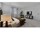 Bright main bedroom with plush bed and sitting area at 16538 W 92Nd Ave, Arvada, CO 80007