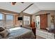 Spacious main bedroom with a barn door leading to the ensuite bathroom at 21806 Saddlebrook, Parker, CO 80138