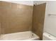 Clean bathroom featuring tile surround and a shower/tub at 2565 S Sheridan Blvd # 20, Denver, CO 80227