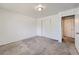 Bedroom with neutral walls, carpet, and a double door closet at 2565 S Sheridan Blvd # 20, Denver, CO 80227