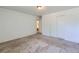 Spacious bedroom with neutral carpeting and a large closet at 2565 S Sheridan Blvd # 20, Denver, CO 80227