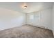 Bright bedroom with neutral carpeting and a window at 2565 S Sheridan Blvd # 20, Denver, CO 80227