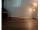 Living room with fireplace and wood-look floors at 2565 S Sheridan Blvd # 20, Denver, CO 80227