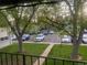 View from balcony of the parking lot and surrounding landscaping at 2565 S Sheridan Blvd # 20, Denver, CO 80227
