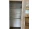 Open storage closet with three shelves at 2565 S Sheridan Blvd # 20, Denver, CO 80227