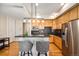 Modern kitchen with island and stainless steel appliances at 1738 N Franklin St # 3C, Denver, CO 80218