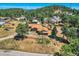 Aerial view of a home on a wooded lot, mountain views at 801 Panorama Dr, Golden, CO 80401