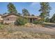 Log cabin style home with surrounding trees at 801 Panorama Dr, Golden, CO 80401