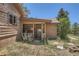 Log cabin exterior featuring a covered entryway at 801 Panorama Dr, Golden, CO 80401