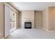 Gathering room with fireplace and sliding glass door to backyard at 1139 S Chester St, Denver, CO 80247