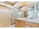 Main bathroom with double vanity and shower/tub combo at 1139 S Chester St, Denver, CO 80247