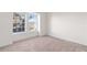 Spacious bedroom with large windows and neutral carpeting at 13750 W 65Th Ave, Arvada, CO 80004