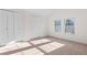 Bright bedroom with two large closets and neutral carpeting at 13750 W 65Th Ave, Arvada, CO 80004