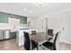 Kitchen dining area with a marble table and black chairs at 13750 W 65Th Ave, Arvada, CO 80004