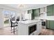 Modern kitchen with stainless steel appliances and access to the backyard at 13750 W 65Th Ave, Arvada, CO 80004