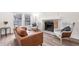 Cozy living room with a fireplace and comfortable seating at 13750 W 65Th Ave, Arvada, CO 80004