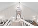 View of a bright, open staircase with white railings and natural light at 13750 W 65Th Ave, Arvada, CO 80004