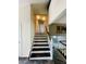 Modern staircase with dark wood and white accents at 3092 S Yarnell Ct, Denver, CO 80231