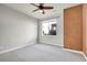 Charming bedroom with a ceiling fan and large window at 301 Inverness Way # 209, Englewood, CO 80112