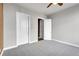 Well-lit bedroom with ceiling fan and ample closet space at 301 Inverness Way # 209, Englewood, CO 80112