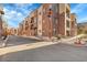 Building exterior showcasing parking and landscaping at 301 Inverness Way # 209, Englewood, CO 80112