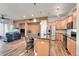 Open concept kitchen with an island and hardwood floors at 301 Inverness Way # 209, Englewood, CO 80112