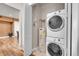 Convenient laundry room with washer, dryer, and water heater at 301 Inverness Way # 209, Englewood, CO 80112