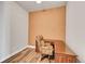 Small office space with a wooden desk and an accent wall at 301 Inverness Way # 209, Englewood, CO 80112