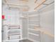 Large walk-in closet with custom shelving and drawers at 301 Inverness Way # 209, Englewood, CO 80112