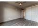 Spacious bedroom with wood-look floors and large closet at 12983 W Ida Ave # 307, Littleton, CO 80127