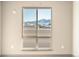 Bedroom window view of snow capped mountains at 12983 W Ida Ave # 307, Littleton, CO 80127