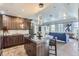 Modern kitchen with dark cabinets, island, and stainless steel appliances at 475 W 12Th Ave # 7G, Denver, CO 80204