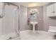 Bathroom with pedestal sink, shower, and updated fixtures at 475 W 12Th Ave # 7G, Denver, CO 80204