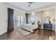 Spacious main bedroom with hardwood floors, access to balcony, and ample natural light at 475 W 12Th Ave # 7G, Denver, CO 80204