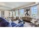 Living room with large windows, stylish furniture, and city view at 475 W 12Th Ave # 7G, Denver, CO 80204