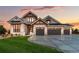 Luxury home with stone facade and three-car garage at 6531 S Harlan Ct, Littleton, CO 80123
