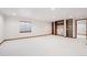 Spacious finished basement with built-in shelving and large windows at 11144 Navajo St, Northglenn, CO 80234