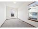 Well-lit bedroom with neutral walls and carpet flooring at 11144 Navajo St, Northglenn, CO 80234