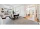 Dining area with hardwood and carpeted floors, view of entryway at 11144 Navajo St, Northglenn, CO 80234