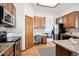 Bright kitchen featuring wood cabinets and modern appliances at 11144 Navajo St, Northglenn, CO 80234