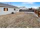 Spacious backyard with a partially fenced area and a view of the house at 4635 Sable St, Denver, CO 80239
