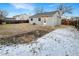 Large backyard with a partially fenced area and a small garden at 4635 Sable St, Denver, CO 80239