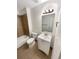 Clean bathroom with a white vanity, shower/tub combo, and tile flooring at 4635 Sable St, Denver, CO 80239